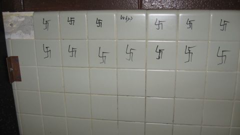 A photograph provided by Pine Bush High School shows swastikas drawn on a wall. 
