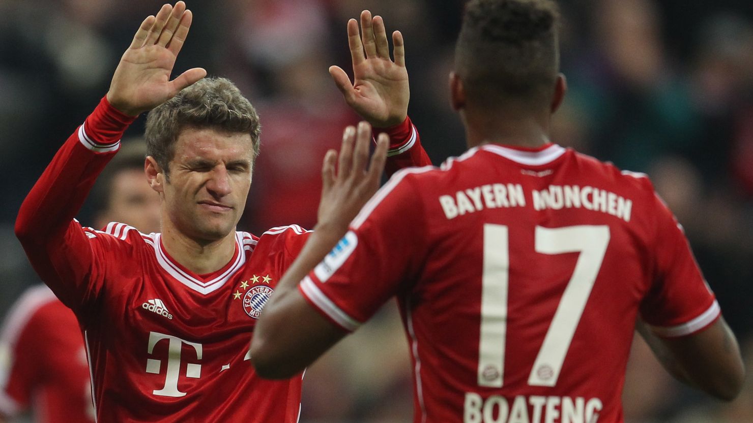 Thomas Mueller (L) celebrates scoring Bayern Munich's third goal with Jerome Boateng who also scored in the 3-0 win.