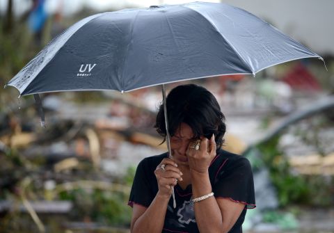 A woman mourns in front of her husband's dead body November 10 in Tacloban.