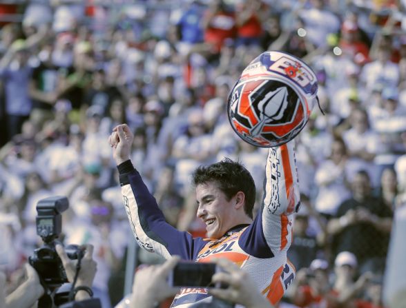 Marc Marquez is hoisted aloft after claiming the MotoGP title. The 20-year-old Spaniard is the youngest rider ever to win the world championship.   