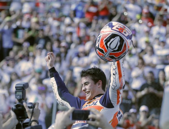 Marc Marquez is hoisted aloft after claiming the MotoGP title. The 20-year-old Spaniard is the youngest rider ever to win the world championship.