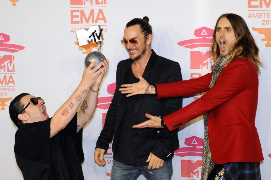 Members of U.S. rock band Thirty Seconds to Mars -- Tomo Milicevic (from left), Shannon Leto and Jared Leto -- pose with their award for best alternative song.