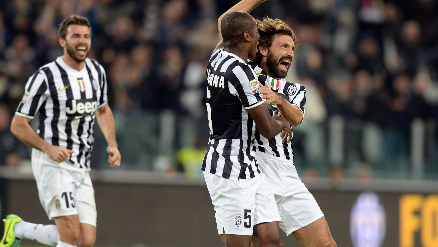 Andrea Pirlo (right) celebrates scoring Juventus' second goal against Napoli on Sunday. 