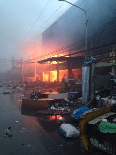 Soon after Super Typhoon Haiyan hit Tacloban, desperate shop owners tried to extinguish fires that broke out in buildings with small buckets of water, storm chaser James Reynolds said.