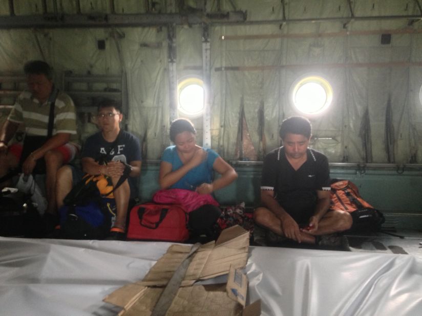 The team caught a flight from Tacloban to Cebu after trying to find a way out of the devastaated city. Reynolds said the atmosphere aboard the C-310 was somber as survivors sat on the ground alongside four body bags.