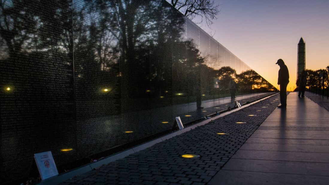 A man visits the Vietnam Veterans Memorial in Washington early Monday morning.