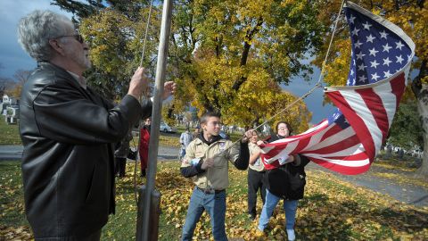 Boy Scouts in Easton, Pennsylvania, raise an American flag during a Veterans Day program on Sunday, November 10.