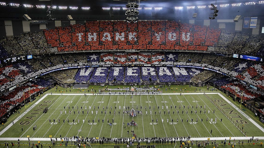 Veterans are honored before the start of Sunday's NFL football game between the New Orleans Saints and the Dallas Cowboys at the Superdome in New Orleans.