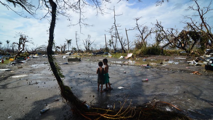 Two young boys look at the devastation in Tacloban on November 10.