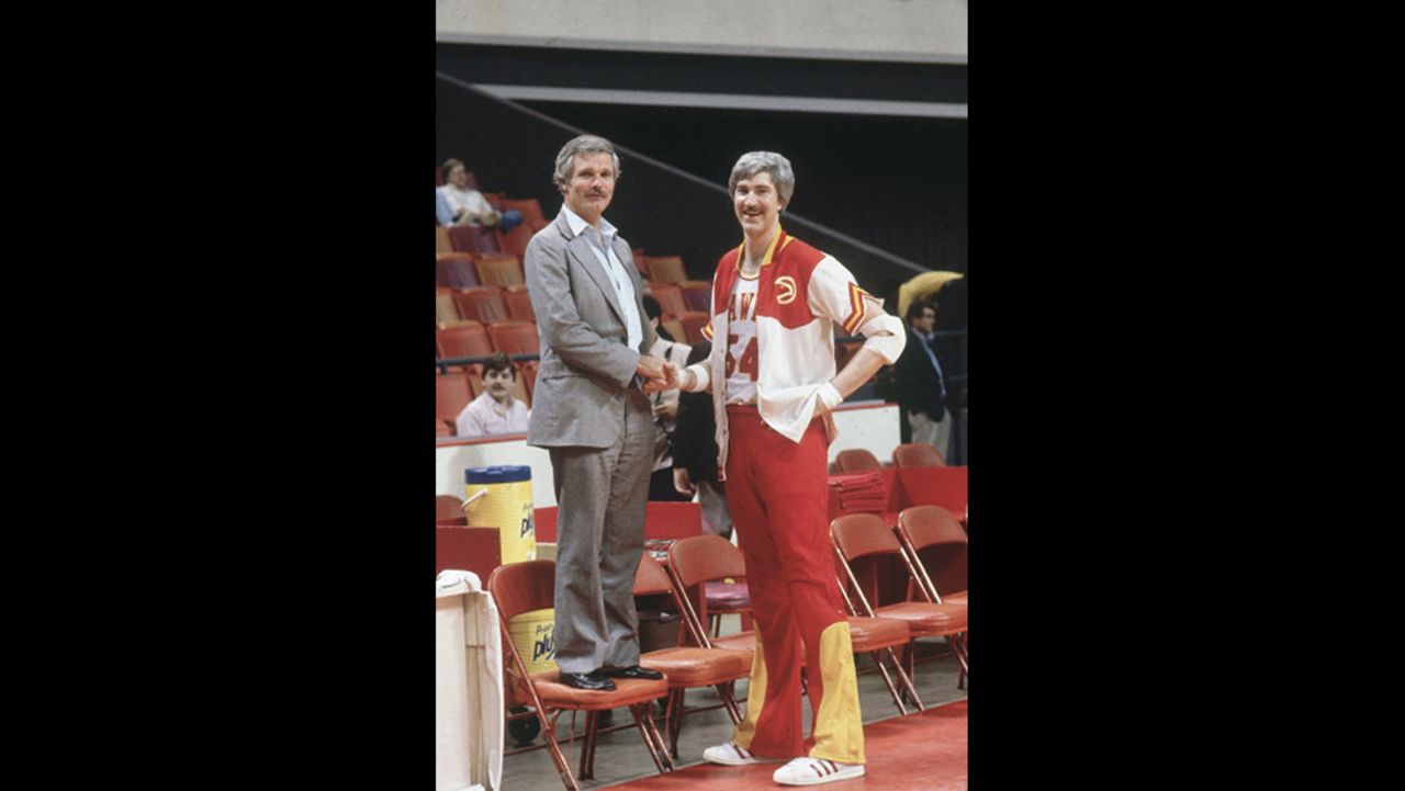 Turner stands next to Atlanta Hawks star Tom McMillen before an NBA game at the Omni Coliseum in Atlanta in March 1982. Turner bought the Hawks in the same year he won the America's Cup. It became his second professional sports team; in 1976, he had purchased the Atlanta Braves baseball team.