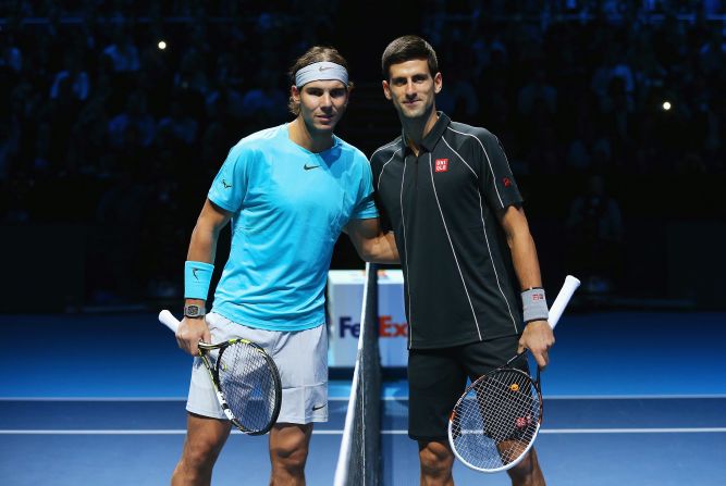 Posing for the camera. Nadal and Djokovic complete the formalities before beginning their ATP Tour Finals showdown.