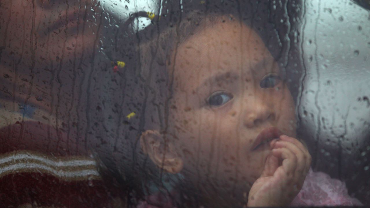 A girl sits inside a bus as she waits for a ferry in Matnog, Philippines, on November 12.