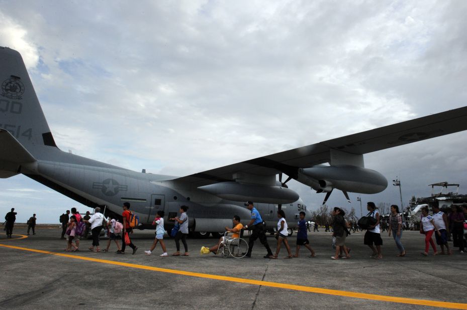 Typhoon survivors in Tacloban, Philippines, board a U.S. plane bound for the capital of Manila on November 11.