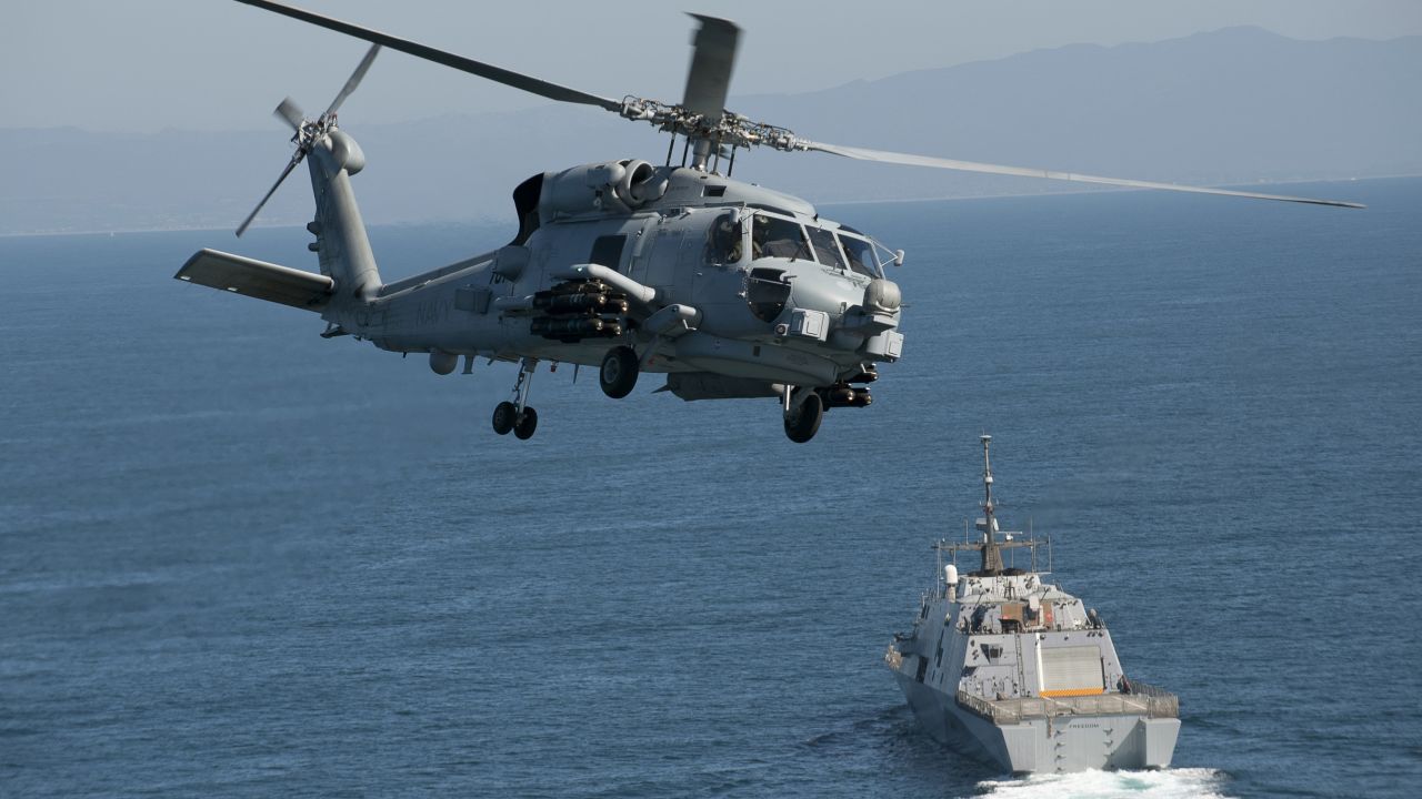 An MH-60R Seahawk flies near in the Pacific Ocean in February.