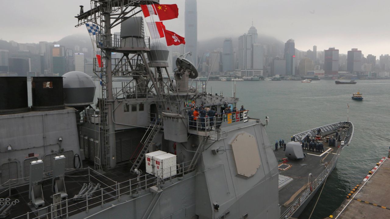 U.S. sailors of the USS Antietam stand on deck at Hong Kong's Victoria Harbor before sailing to the Philippines on November 12.