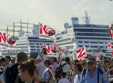 In September, protesters launched themselves into the water and managed to delay several ships from sailing up the Giudecca canal while others clashed with riot police on the banks.