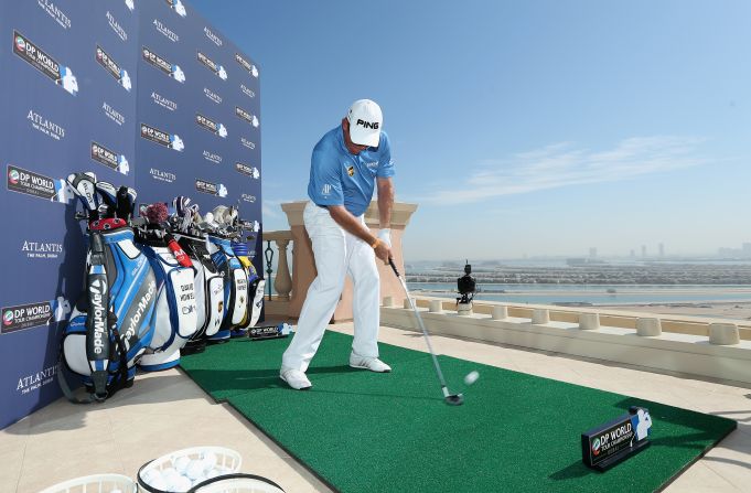 England's Lee Westwood, also a former world No. 1, set the early pace, smashing a seven iron to within eight feet of the pin.