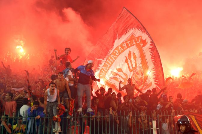 Fans of Al Ahly celebrate as the team nicknamed the Red Devils win a record eighth African club crown, beating South Africa's Orlando Pirates 2-0 on Sunday to take the final 3-1 on aggregate.