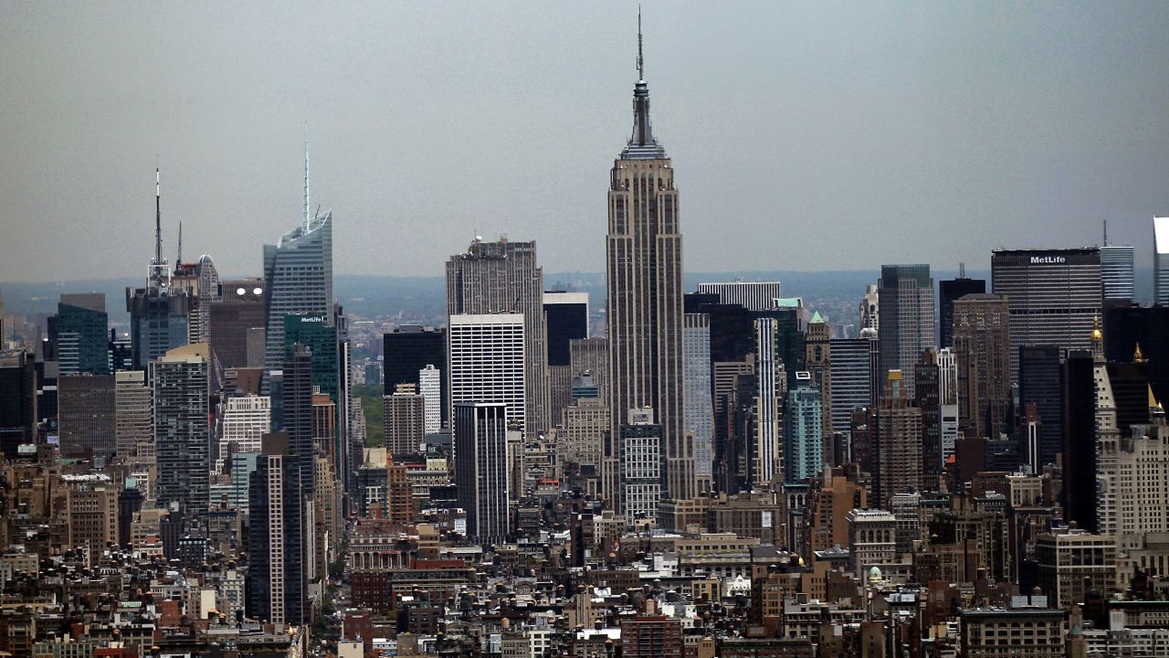 The couple silently knelt in an isolated area of the Empire State Building's observation deck, according to court documents.