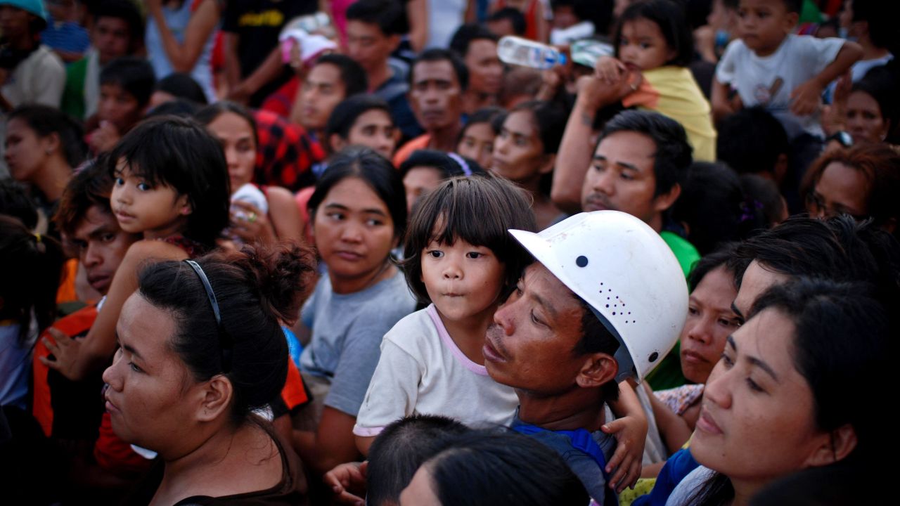 Evacuees wait to board a military aircraft in Leyte on Tuesday, November 12.
