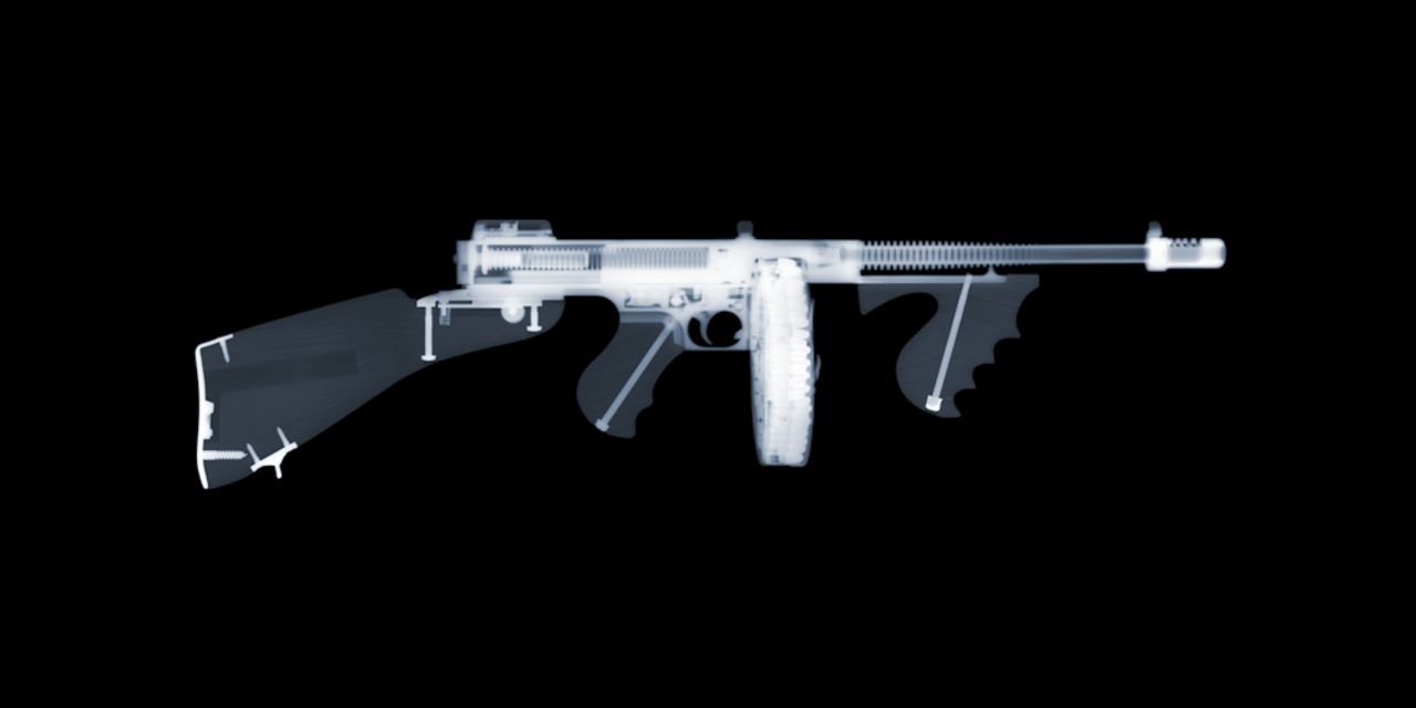 British photographer Nick Veasey uses five X-ray machines in a fortified studio to capture eerie images revealing the innards of large metal objects, from cars to firearms. This photo is of a Tommy gun.