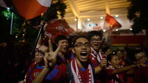 Guangzhou Evergrande fans celebrate as they leave the stadium following their team's victory against FC Seoul in the AFC Champions League on Saturday.