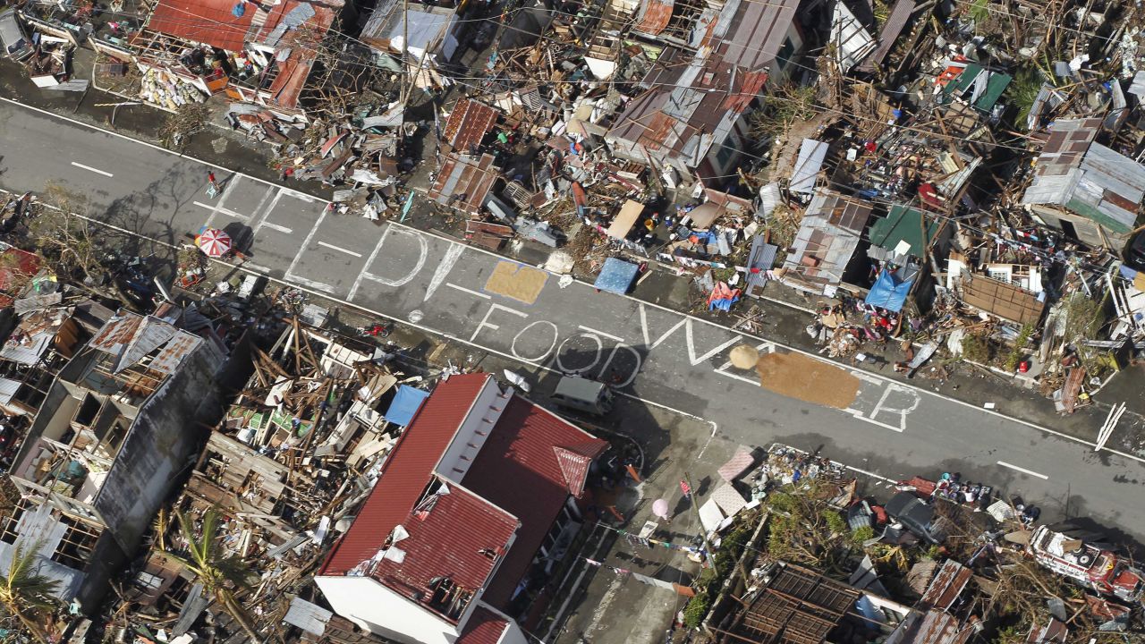 An aerial view of Tanuan shows signs pleading for help and food November 13.