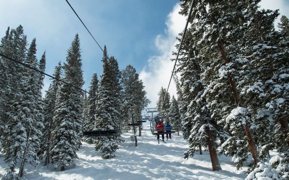 Ski lift takes folks up at The Canyons in Utah.