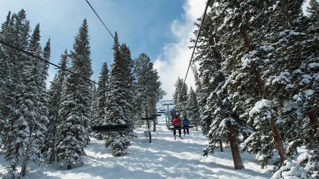 Ski lift takes folks up at The Canyons in Utah.