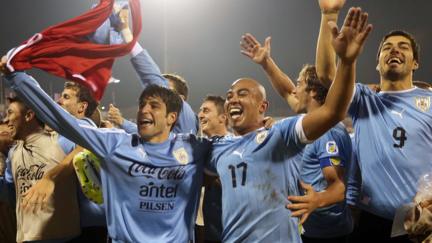 Uruguay's players celebrate after their 5-0 triumph in the first leg of their World Cup playoff with Jordan.
