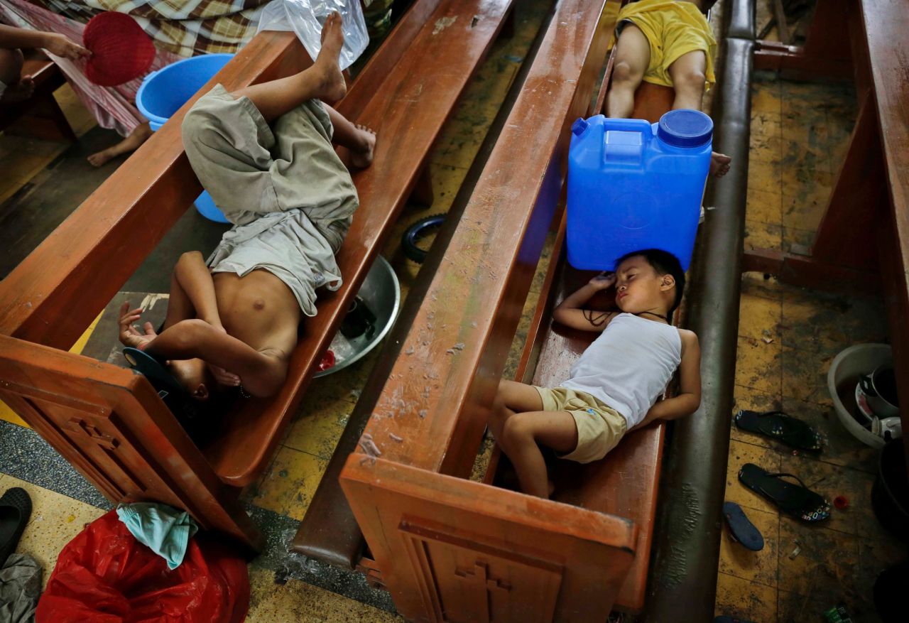 Residents take shelter in a Tacloban church on November 13.