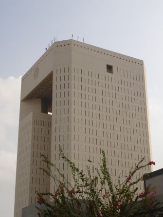 Architect: Nikken Sekkei Ltd.<br />The two towers of the Islamic Development Bank Headquarters in Jeddah are connected by a roof structure. <br />The building, which is over 100 meters tall, has a sophisticated design: narrow window slits in the outer walls serve to block the strong sunlight while the central patios are covered in glass in order to let in natural light.