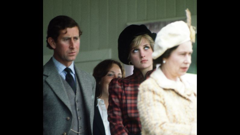The prince and Princess Diana are seen behind the Queen during the Braemar Highland Games in Scotland in September 1981.