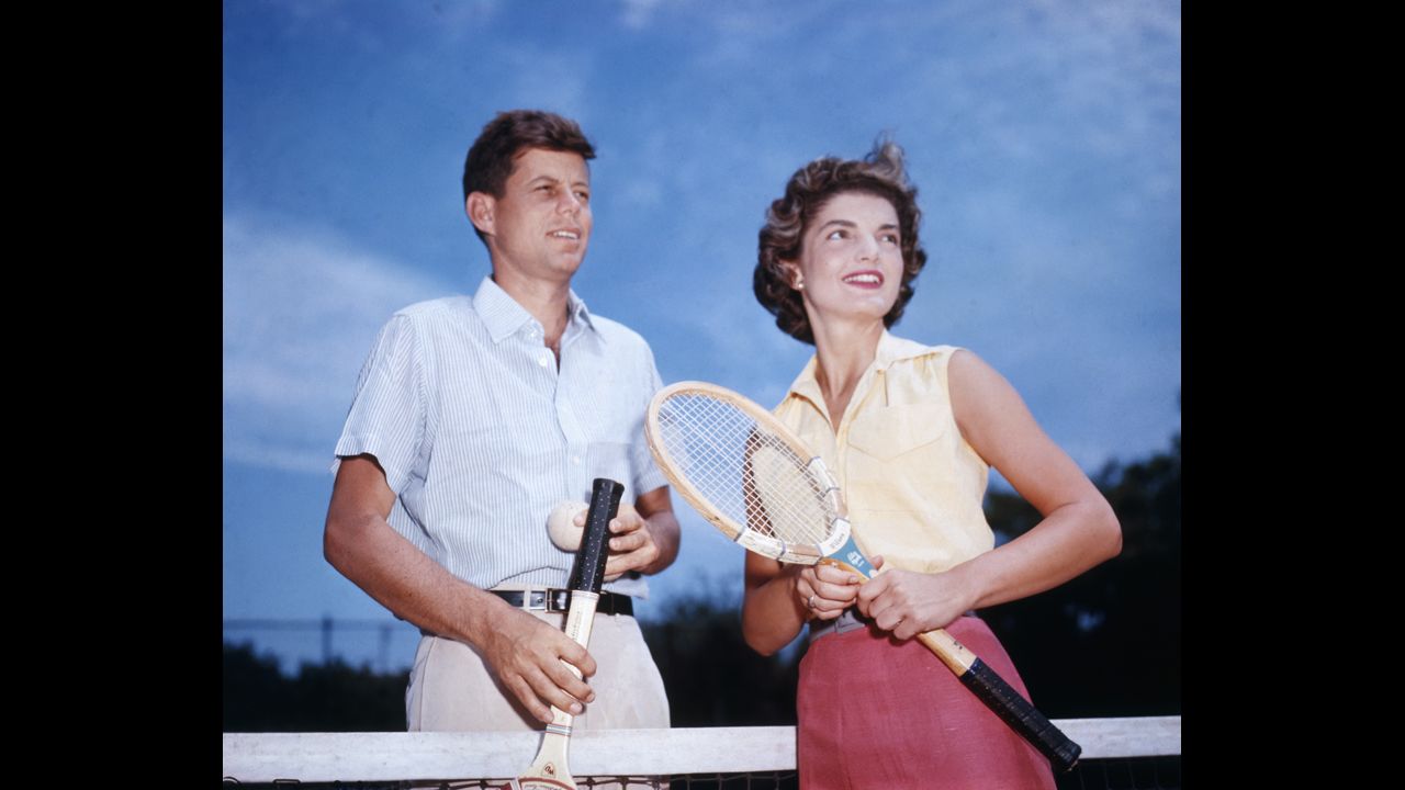 John Fitzgerald Kennedy and his fiancée, Jacqueline Lee Bouvier, playing tennis in 1953. They were one of history's power couples, a dashing Democrat and an elegant wife. They were both from influential families and became superstars before he entered the White House. Take a look back at the couple that embodied the image of a perfect family. 