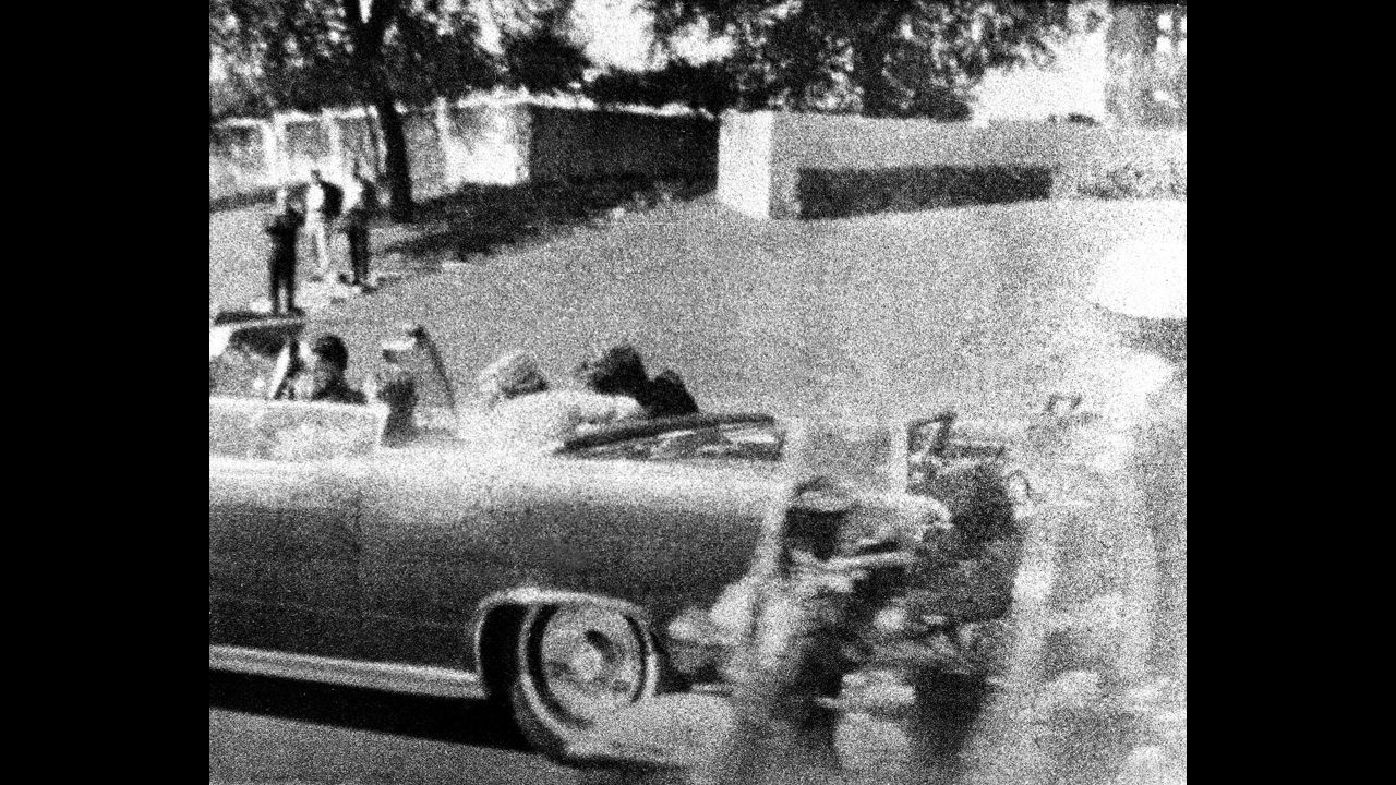 Kennedy slumps against his wife as the bullet strikes him in the head. Connally, who is wounded in the attack, begins to turn around just to the left of Jackie Kennedy. 