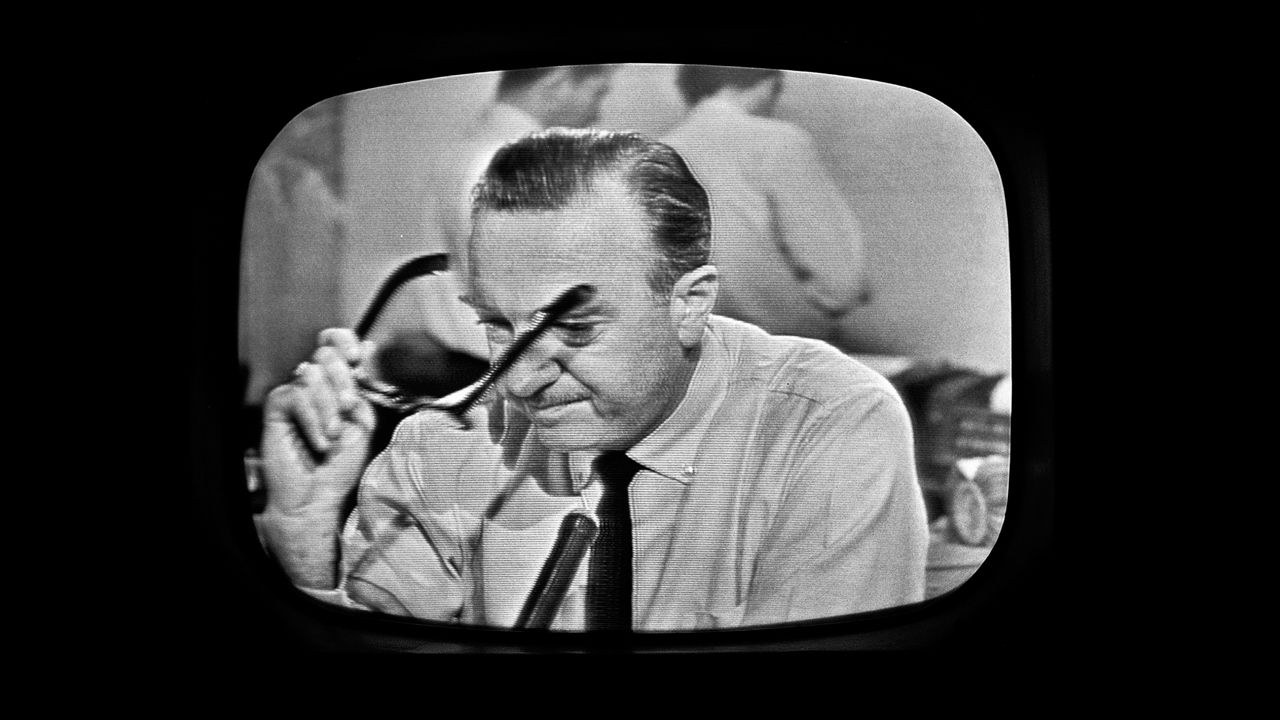 American broadcast journalist and anchorman Walter Cronkite removes his glasses and prepares to announce Kennedy's death. CBS broadcast the first nationwide TV news bulletin reporting on the shooting.