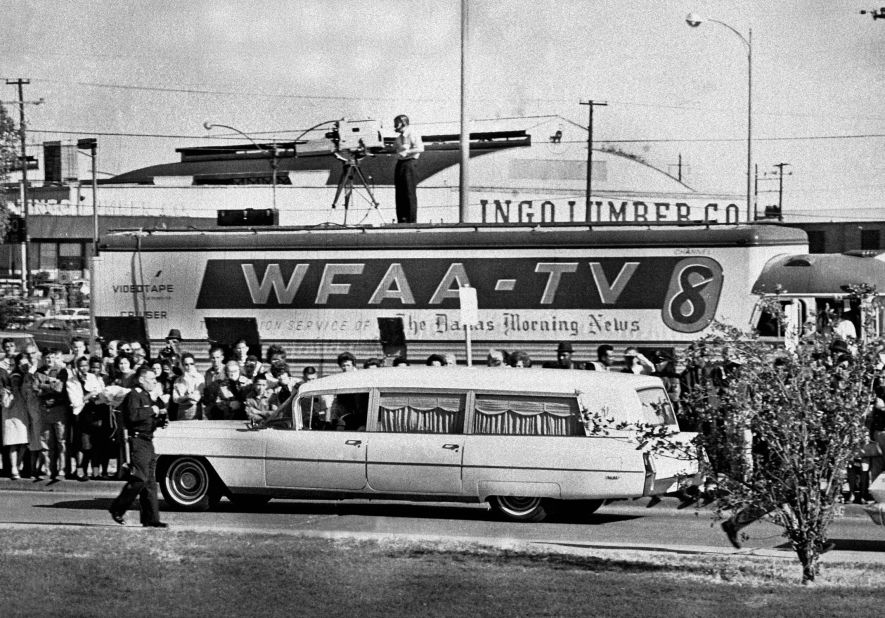 The hearse carrying Kennedy's body pulls away from Parkland Hospital en route to the airport.