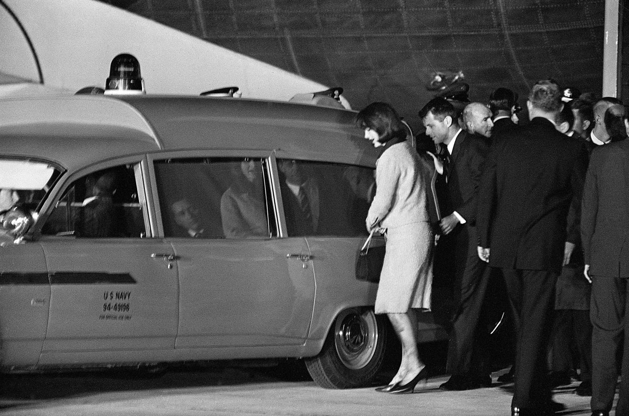 Jacqueline and Robert Kennedy get into the Navy ambulance with the president's body at Andrews Air Force Base, just outside Washington. The body of the president is taken to Bethesda Naval Hospital for an immediate autopsy. 