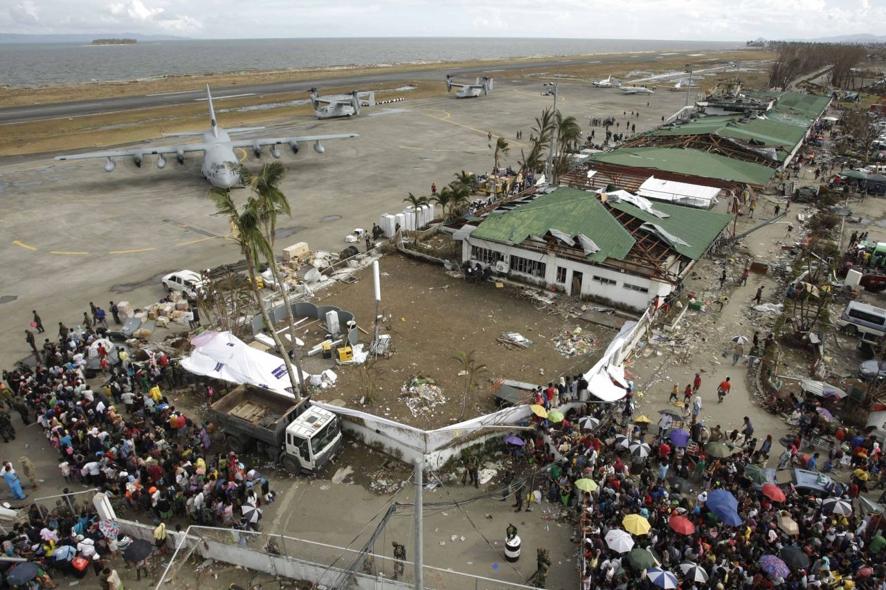 Stranded passengers board a plane in Tacloban on Wednesday, November 13.