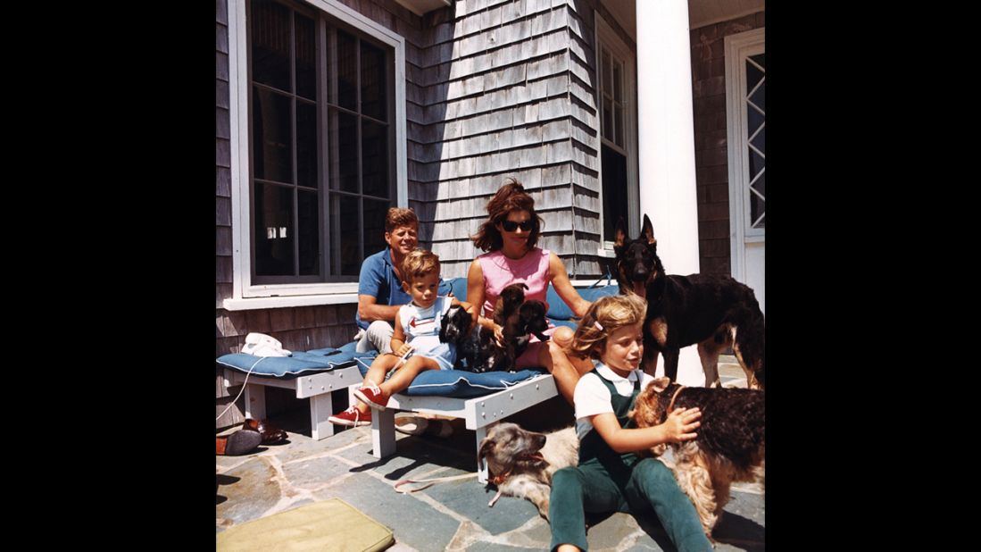 President Kennedy, John F. Kennedy Jr., Jackie and Caroline with puppies Blackie and White Tips, and family dogs Shannon, Clipper, Wolfie and Charlie on August 14, 1963. 