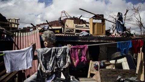 Teresa Mazeda hangs laundry in the ruins of her Tacloban home on Wednesday, November 13.