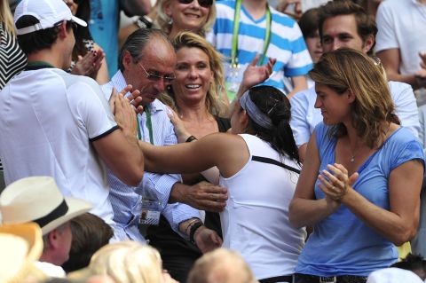 Bartoli made her way to her player box after the final and exchanged hugs with her team, which included dad Walter (middle) and former Wimbledon champion Amelie Mauresmo (right). Walter coached his daughter from a young age. 