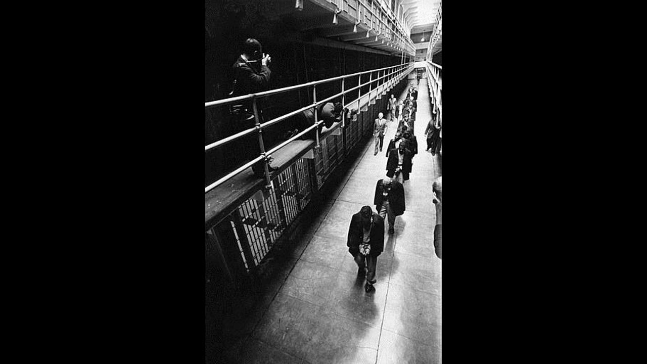 A line of handcuffed prisoners, the last convicts held at Alcatraz prison, walk through a cell block as they are transferred to other prisons from Alcatraz Island on San Francisco Bay, California, on March 21, 1963. Alcatraz, known as "The Rock," was a federal penitentiary for 29 years and a prison for more than a century. 