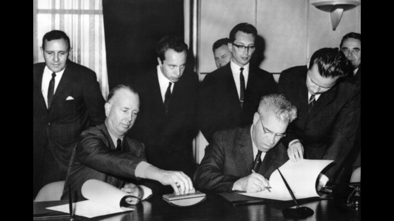 United States representative Charles Stelle, left, and his Soviet counterpart, Seymon Tsarapkin, meet on June 20, 1963, in Geneva, to sign the Memorandum of Understanding Regarding the Establishment of a Direct Communications Line, an agreement to set up a hot line between the two superpowers. The "red phone" between Washington and Moscow was declared operational August 30, 1963.