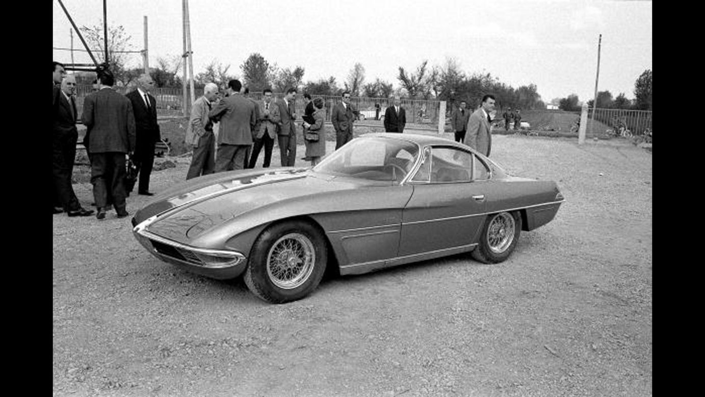 The Lamborghini 350GTV with the body by Franco Scaglione is launched at the Lamborghini Factory, Sant'Agata, Italy, in October 1963. Among the onlookers, with white hair and light-colored jacket, is Piero Taruffi, winner of the last Mille Miglia in 1957. 