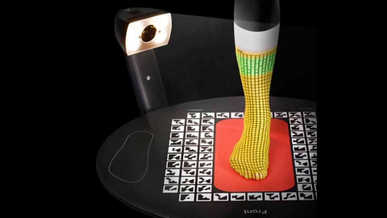 The scanning technology records highly-accurate measurements for a customer's feet in-store.