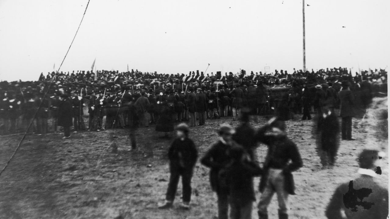 Crowds attend the dedication of the Gettysburg cemetery where Abraham Lincoln delivered his famous Gettysburg Address.