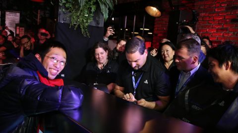 Joey Chiu, left, of Brooklyn, buys the first PlayStation 4 sold in North America at a launch event in New York City.