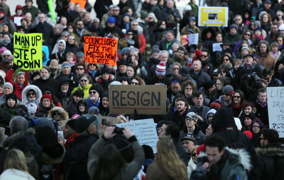 Hundreds gather in Toronto's Nathan Phillips Square on Wednesday, November 13, to call for Ford to resign.
