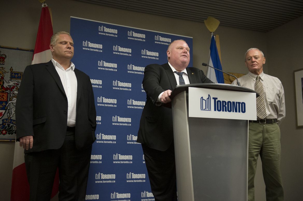 Ford denies using crack during a news conference at City Hall in May 2013. On his right is Deputy Mayor Doug Holyday and on his left is his brother Councilor Doug Ford. Allegations that the mayor had been caught on video smoking crack surfaced in news reports in May. Ford initially insisted the video didn't exist.